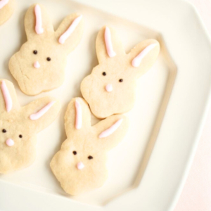 easter shortbread cookies shaped like bunnies on a white platter