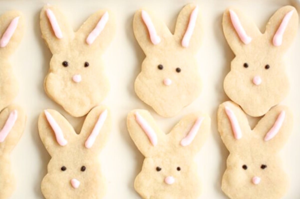 easter shortbread cookies shaped like bunnies on a white platter