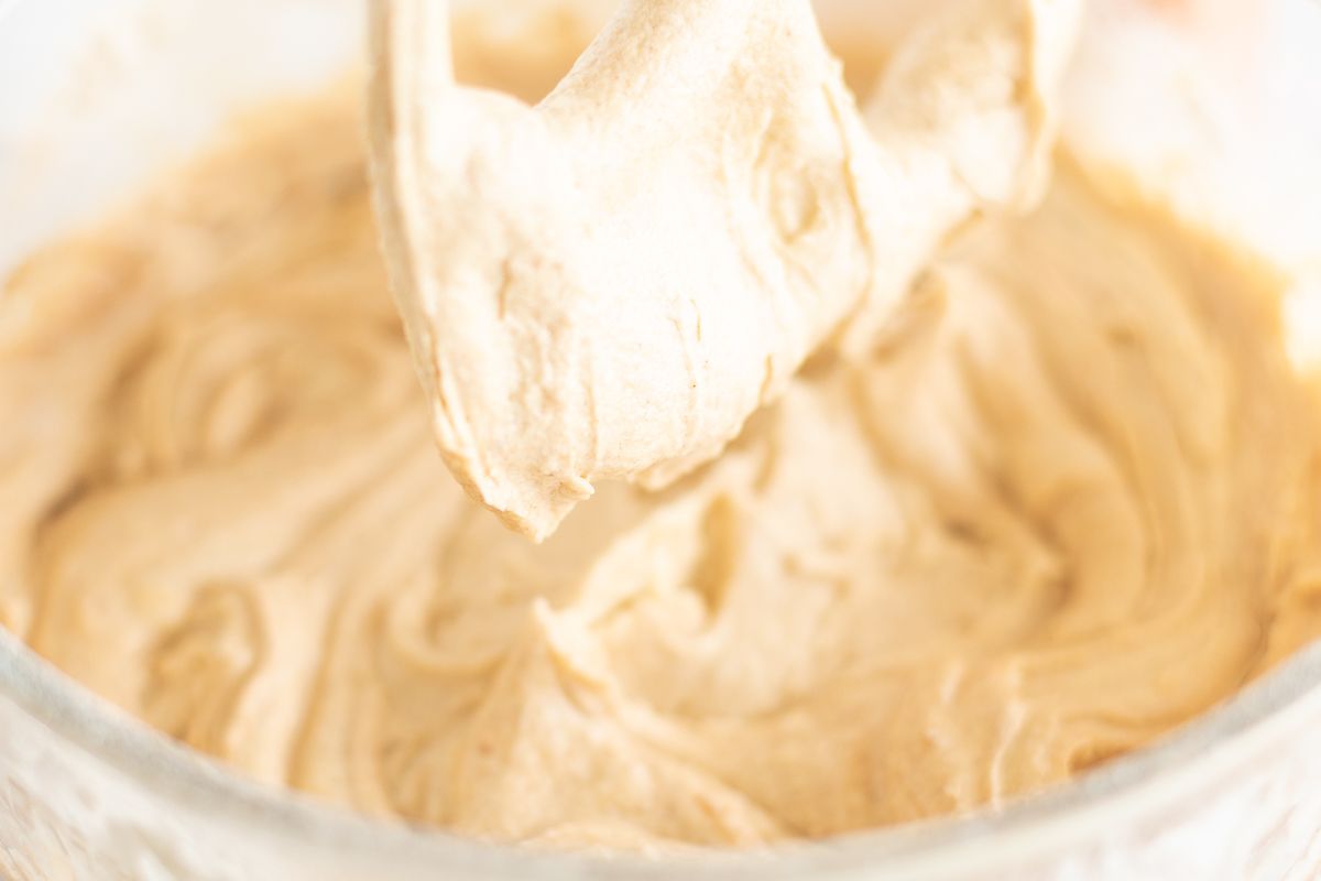 A mixer bowl filled with batter for an easy pound cake recipe.