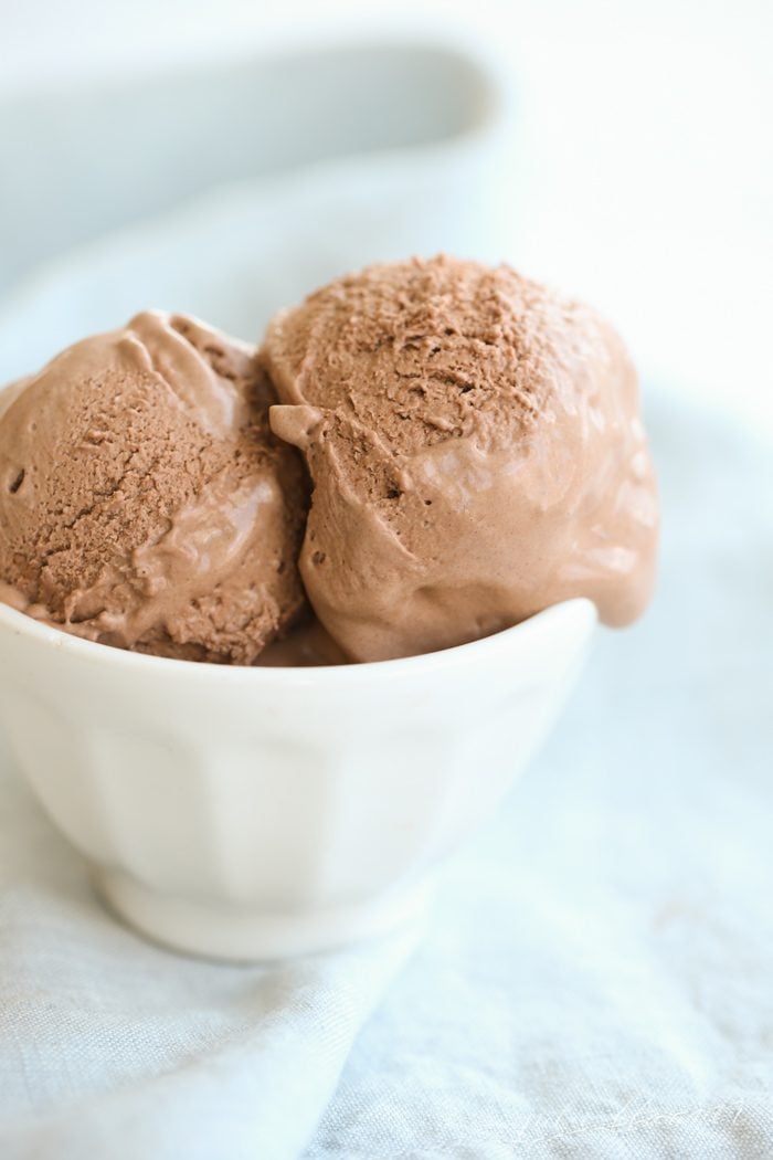 Ice cream melting in a white bowl