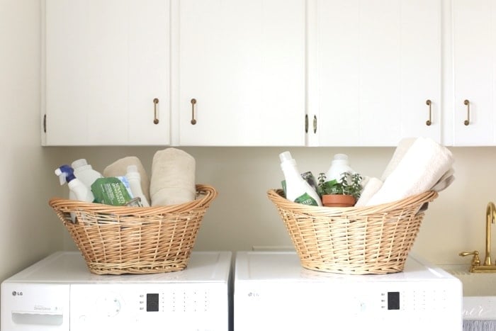 laundry gift baskets sitting on a washer and dryer