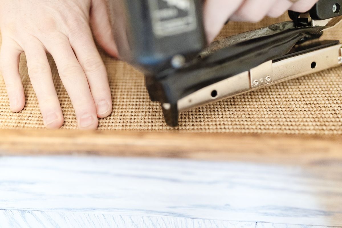 A carpet stapler against a stair runner