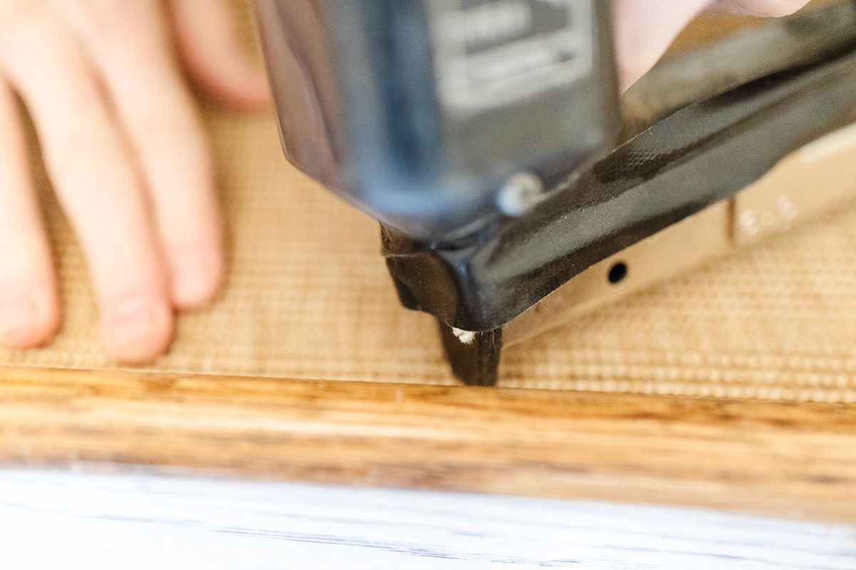 A carpet stapler against a stair runner