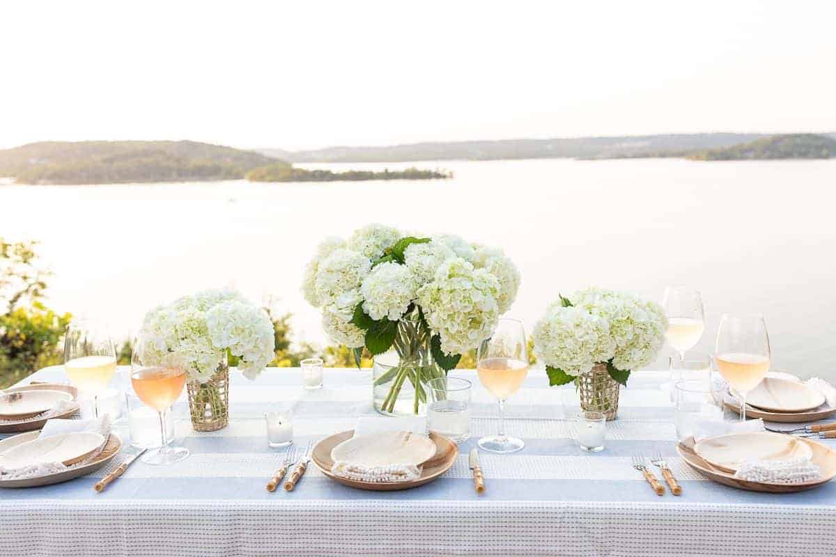 A table set up with water views for al fresco dining.