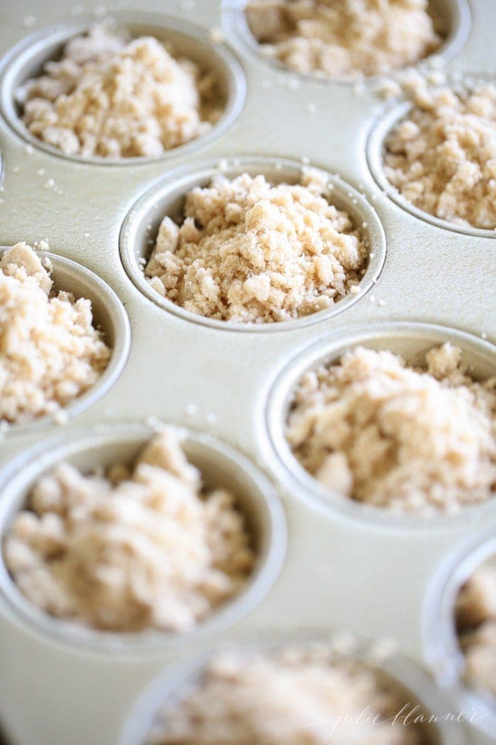 Unbaked muffins with a crumble topping added