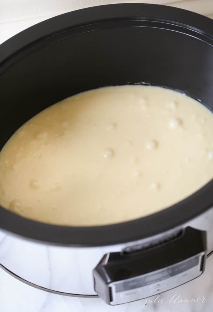 Crockpot fudge in the making, with melted white chocolate fudge inside.