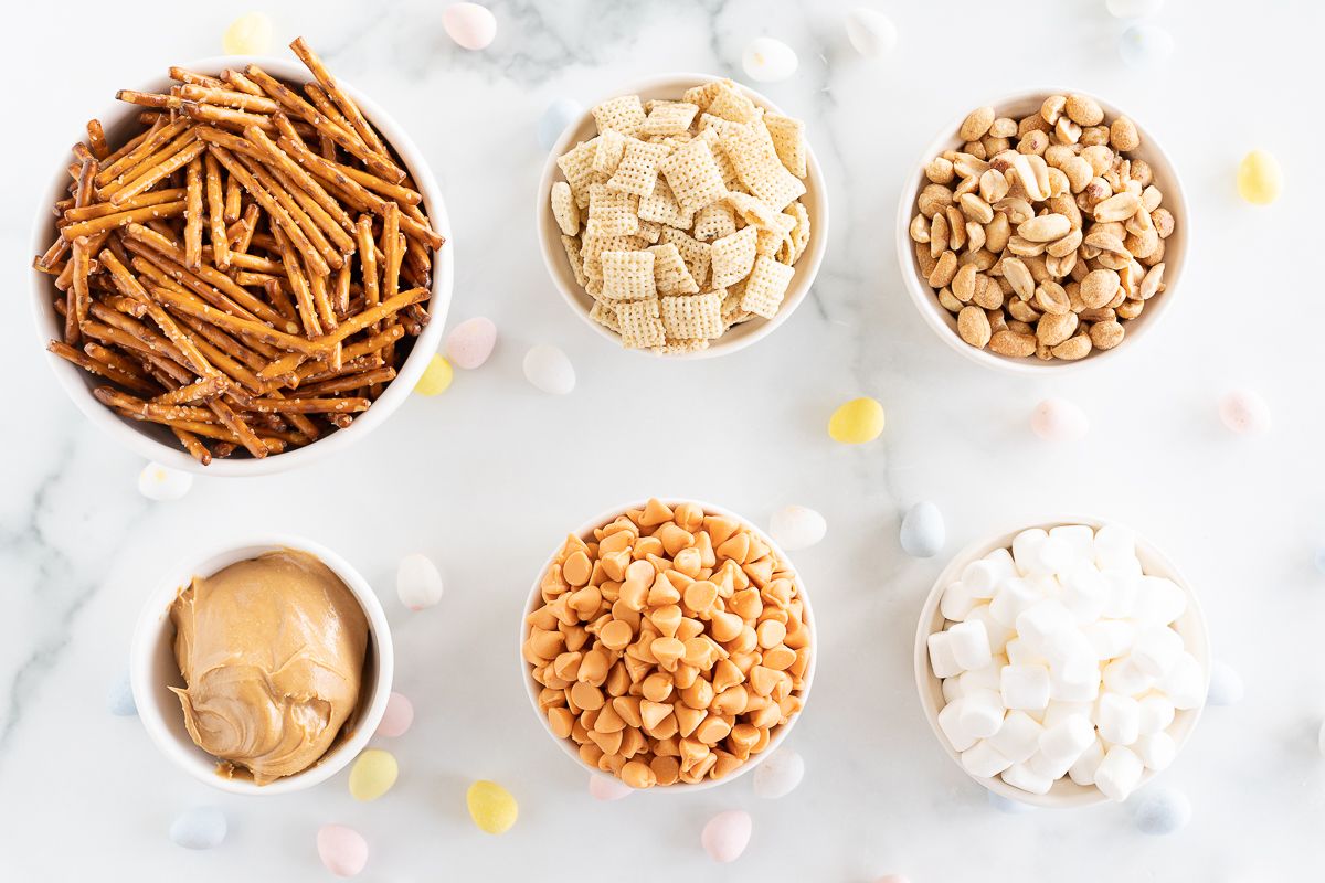 Ingredients for no bake eggs nest cookies on a marble countertop. 