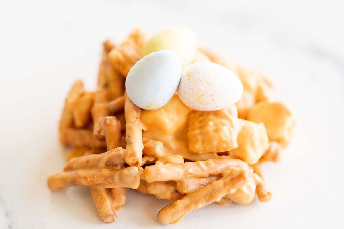 A close up of cadbury eggs on a no bake birds nest cookie.