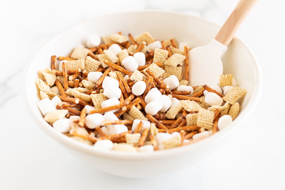 A bowl with ingredients for no bake birds nest cookies.