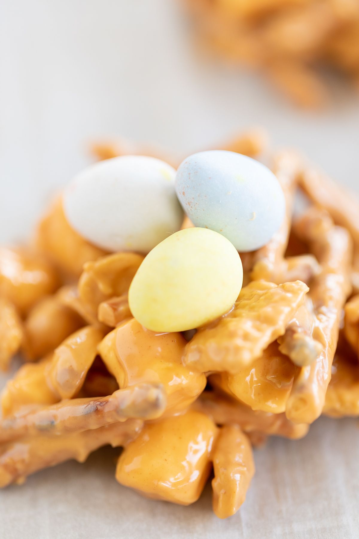 A close up of cadbury eggs on a no bake birds nest cookie.