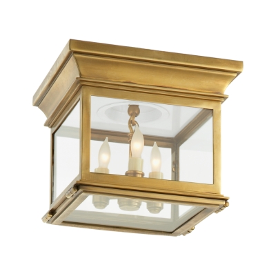 A brass flush mount lantern ceiling light.