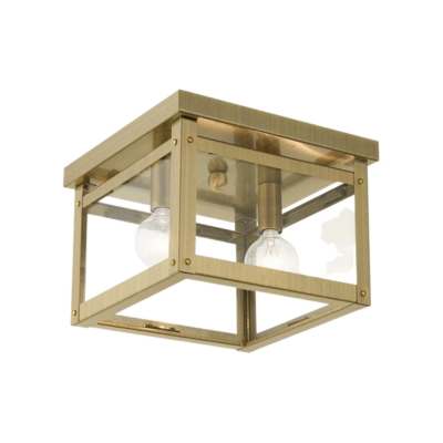 A brass flush mount lantern ceiling light.