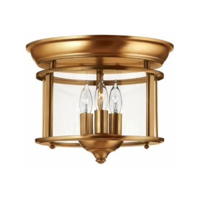 A brass flush mount lantern ceiling light.