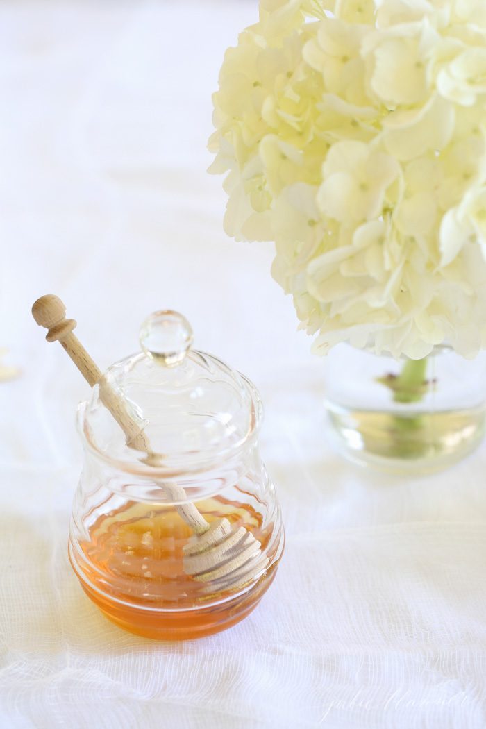 A glass jar with honey in it