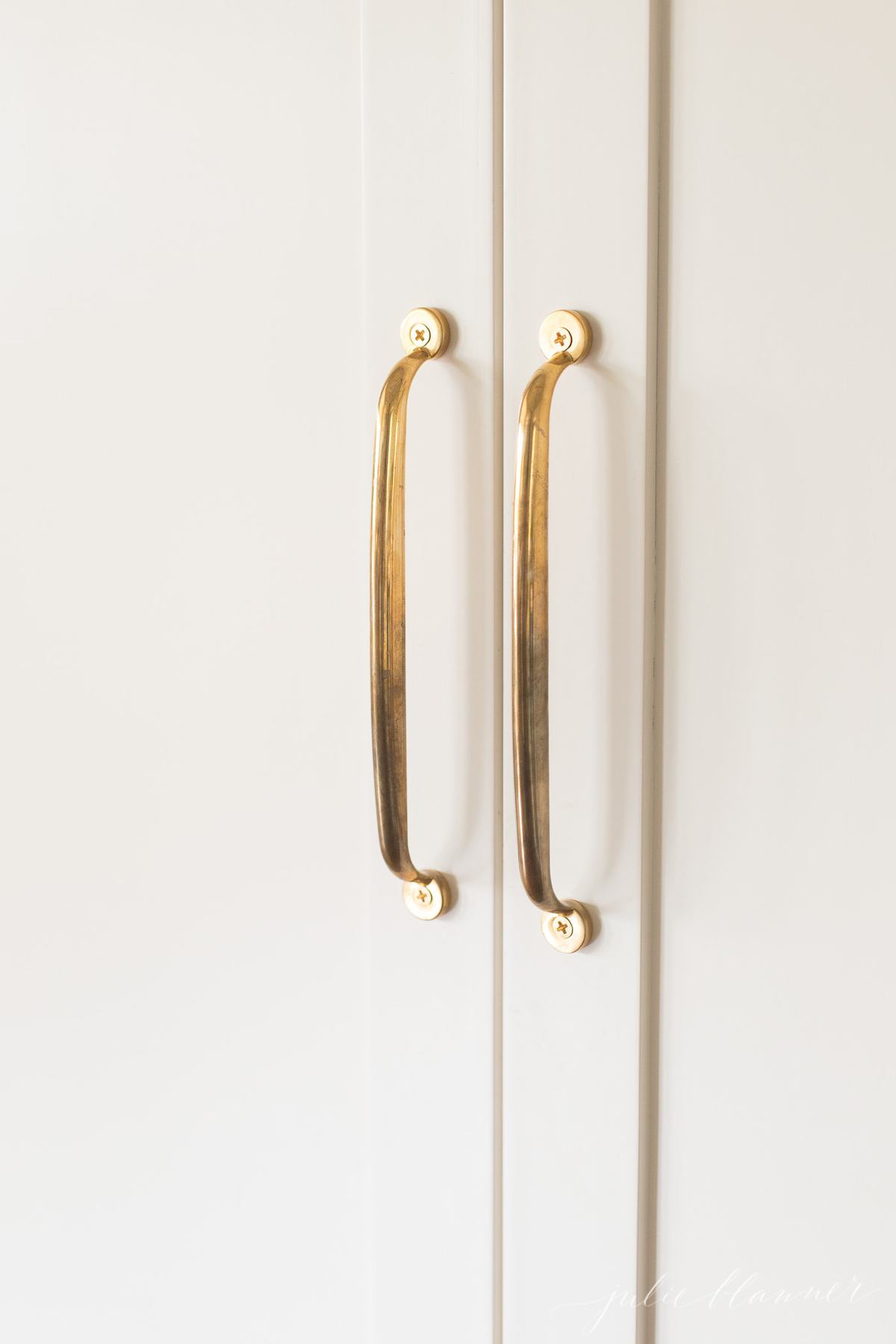 unlacquered brass appliance pulls on refrigerator