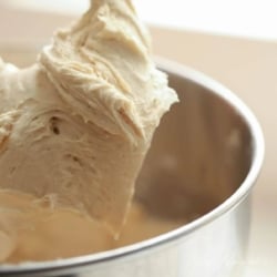 apple buttercream on the paddle of a stand mixer