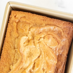 Caramel cream cheese bread baked in a gold loaf pan