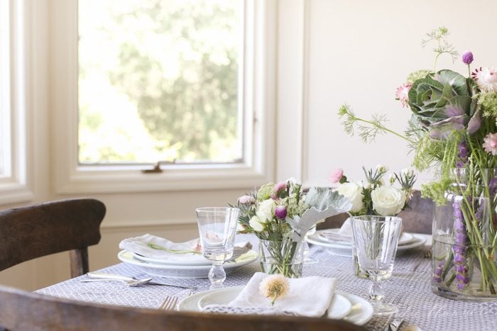 cream breakfast room decorated for fall with restoration hardware chairs and block print table cloth