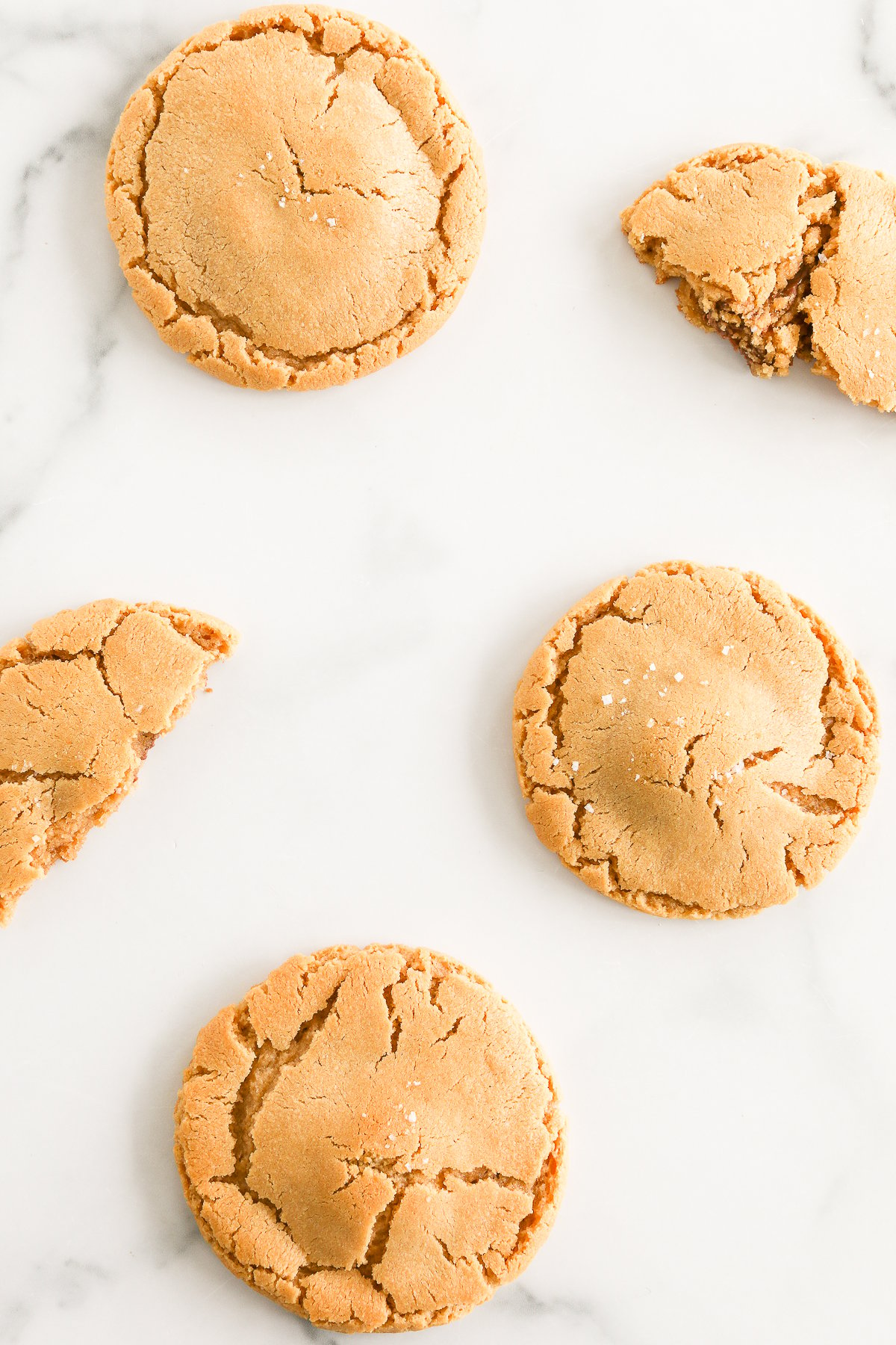 Stuffed peanut butter cookies on a marble table.