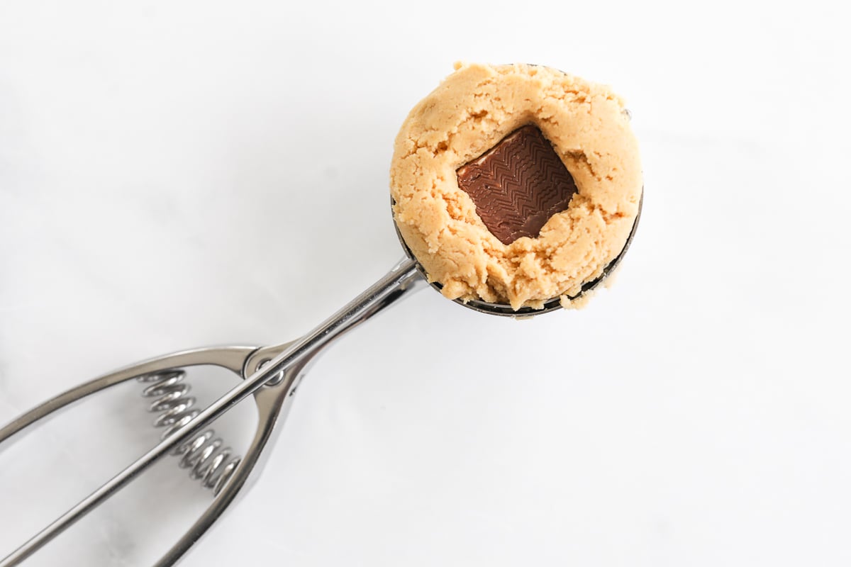 A stuffed peanut butter cookie on a spoon.