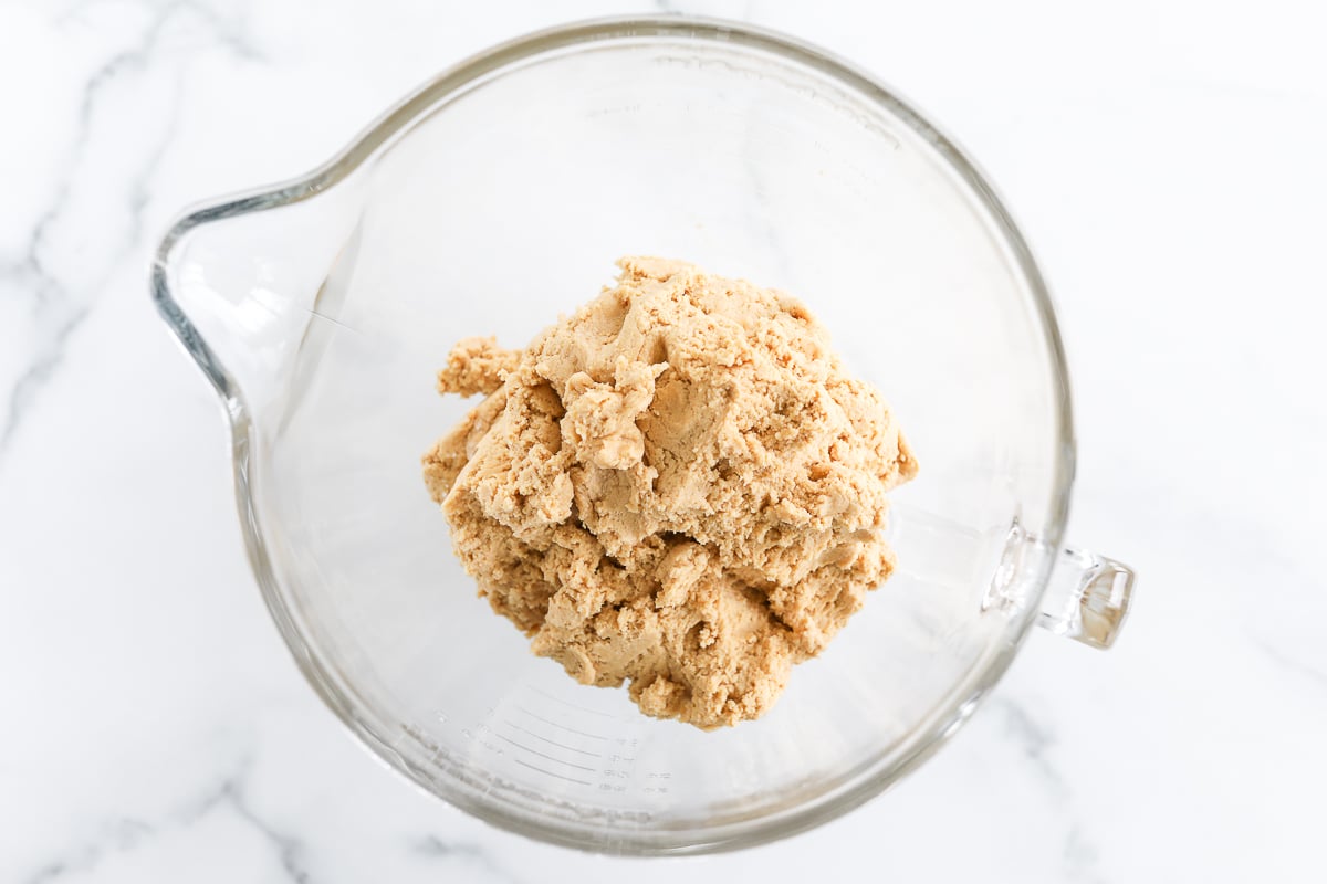 Stuffed peanut butter cookie dough in a glass bowl.