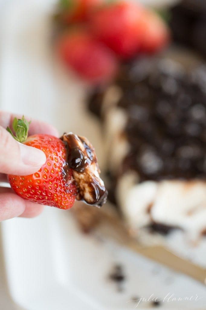 cookies and cream cheese spread on a strawberry