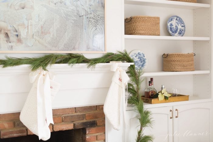 traditional fireplace with brick and wood mantel flanked with bookcases