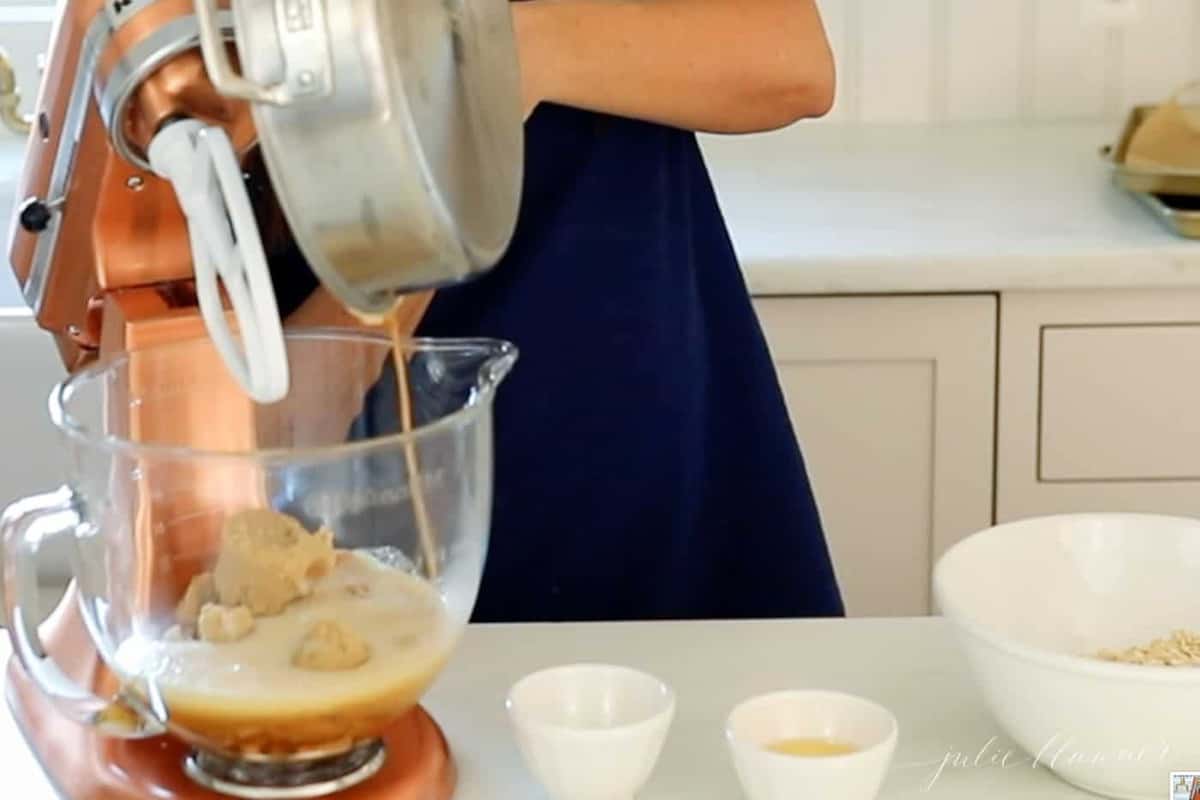 adding brown butter to mixture