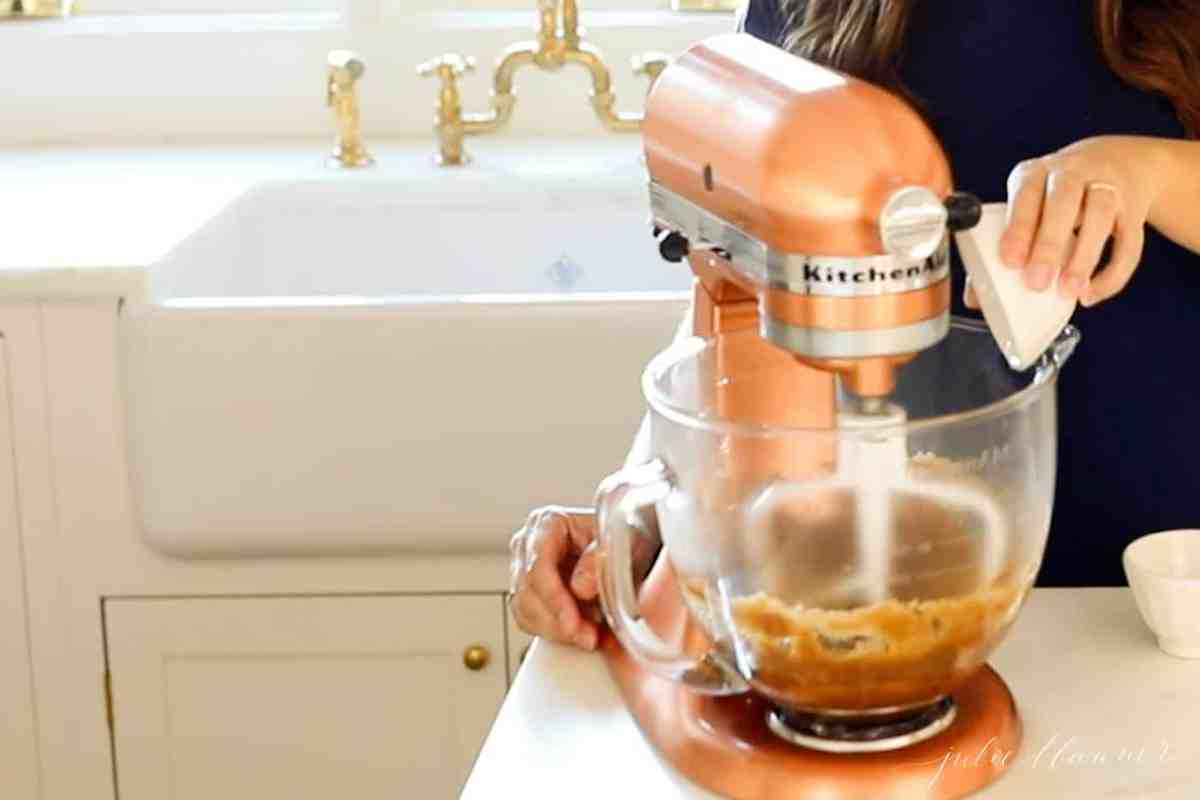 adding egg to cookie batter