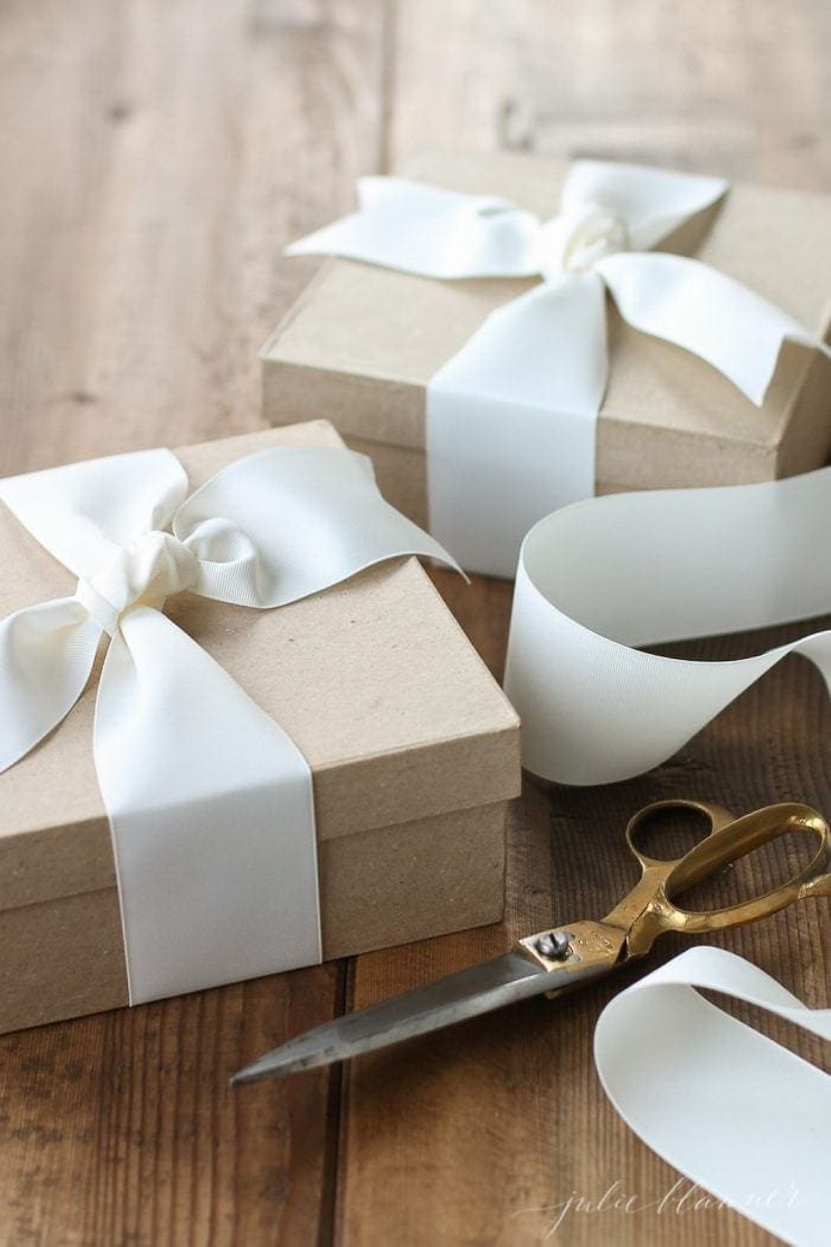 Brown kraft paper boxes tied with white satin bows