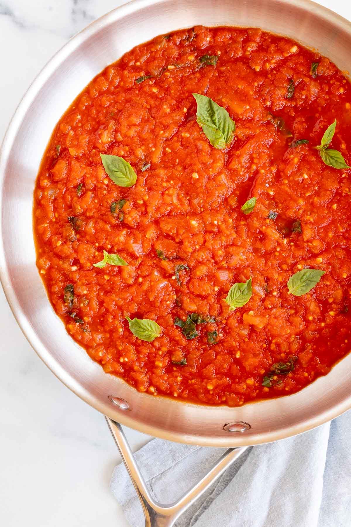 A silver saucepan full of pomodoro sauce