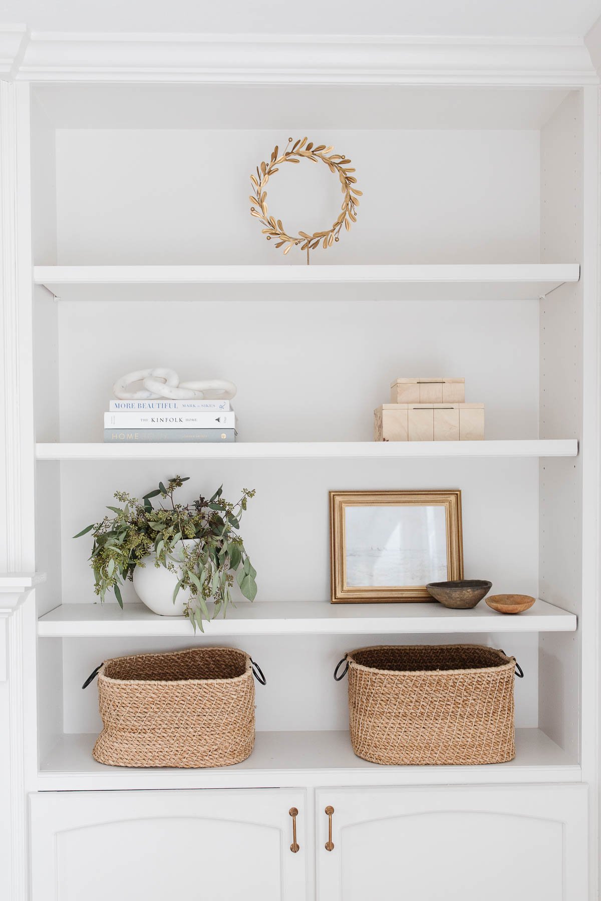 bookshelves painted in zurich white with decorative accents