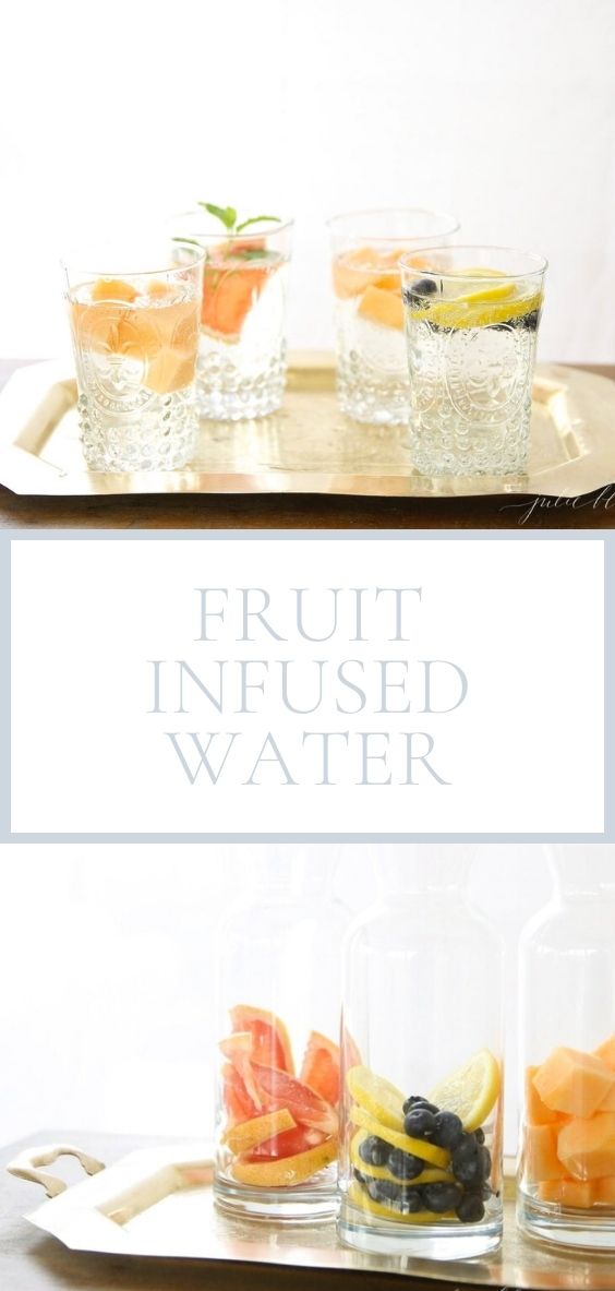 Fruit infused water is pictured in clear glasses on a golden tray.