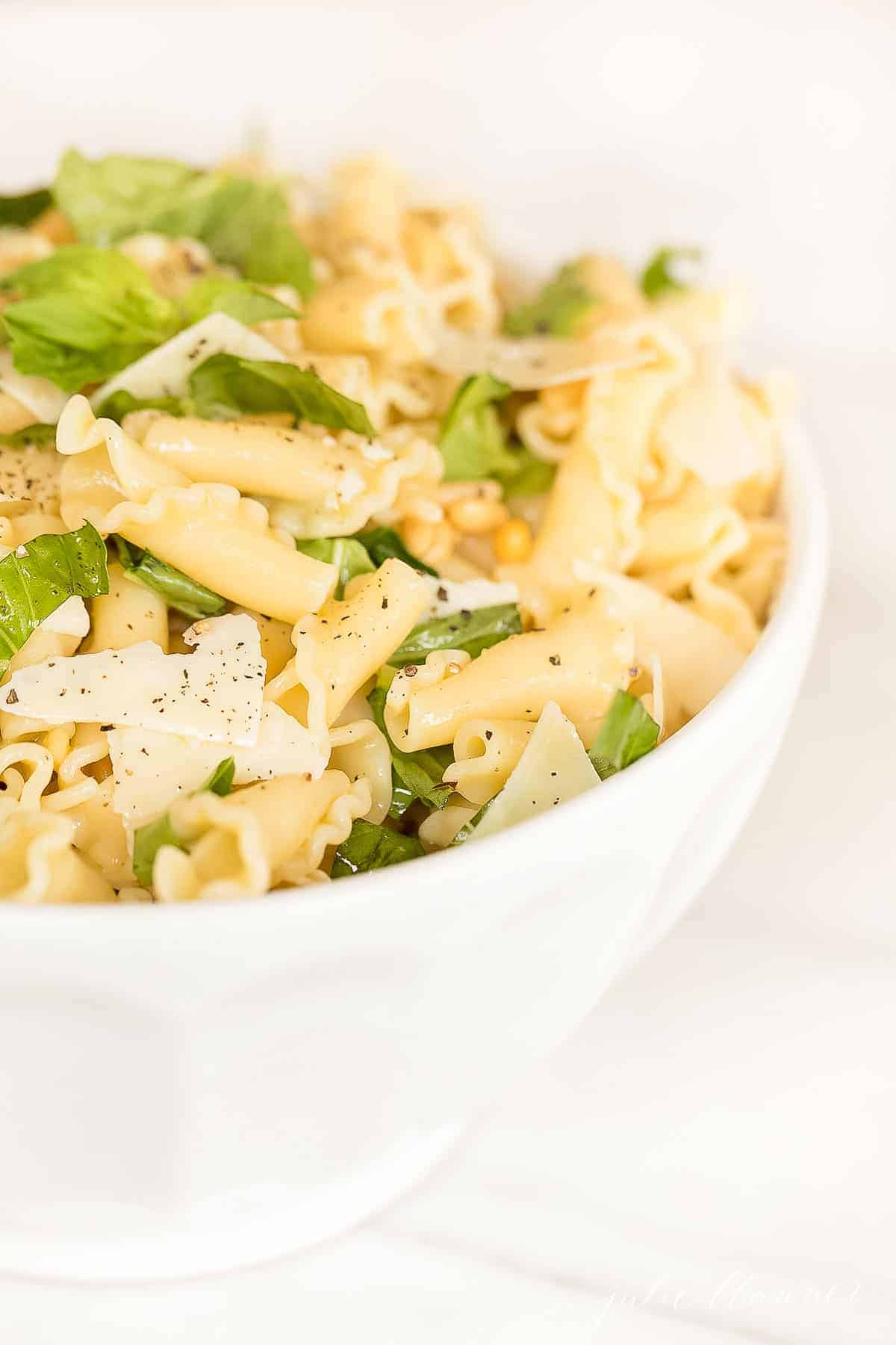 lemon basil pasta salad in white bowl