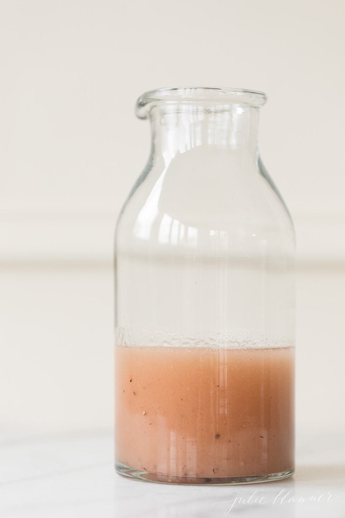 red wine vinaigrette in a glass bottle