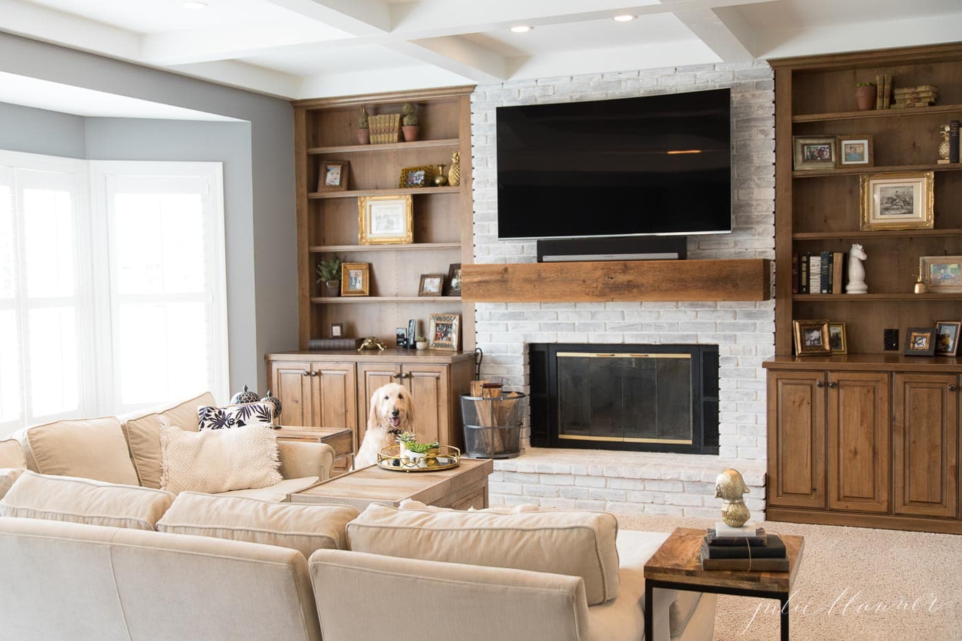 living room with coffered ceilings