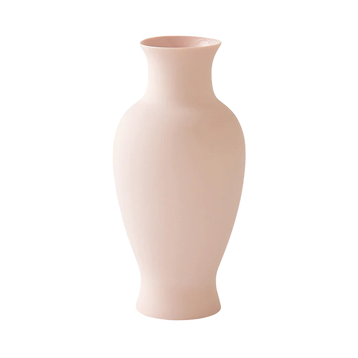 A blush pink flower vase on a white background.