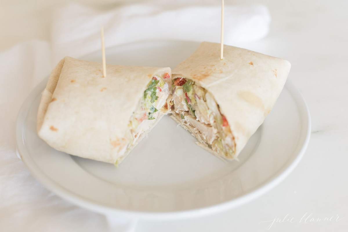 chicken wrap cut in half on plate