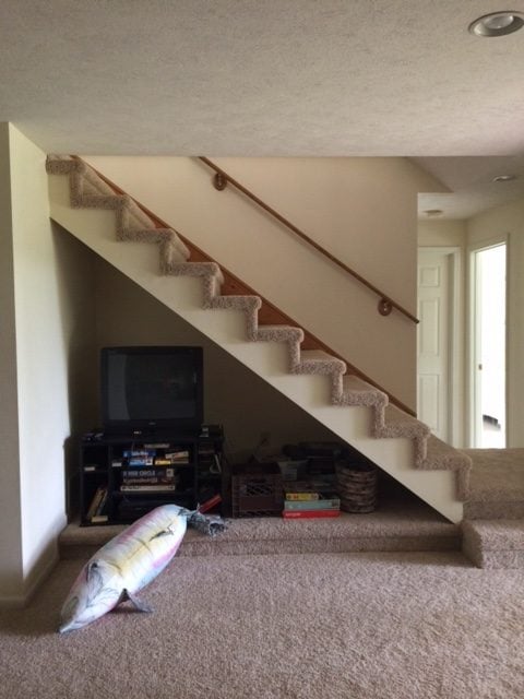 Living room before being remodeled, cream walls and brown carpet. 