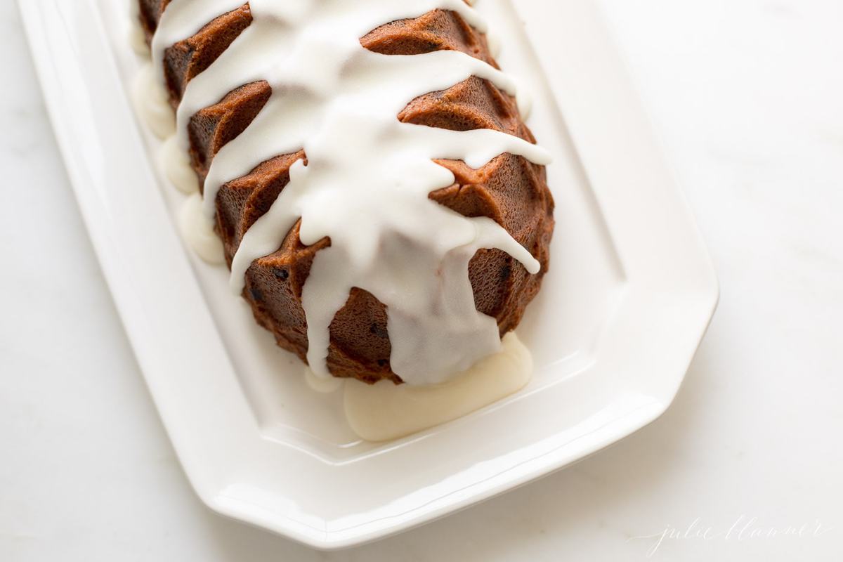 chocolate chip pound cake shaped in a decorative loaf, on a white platter