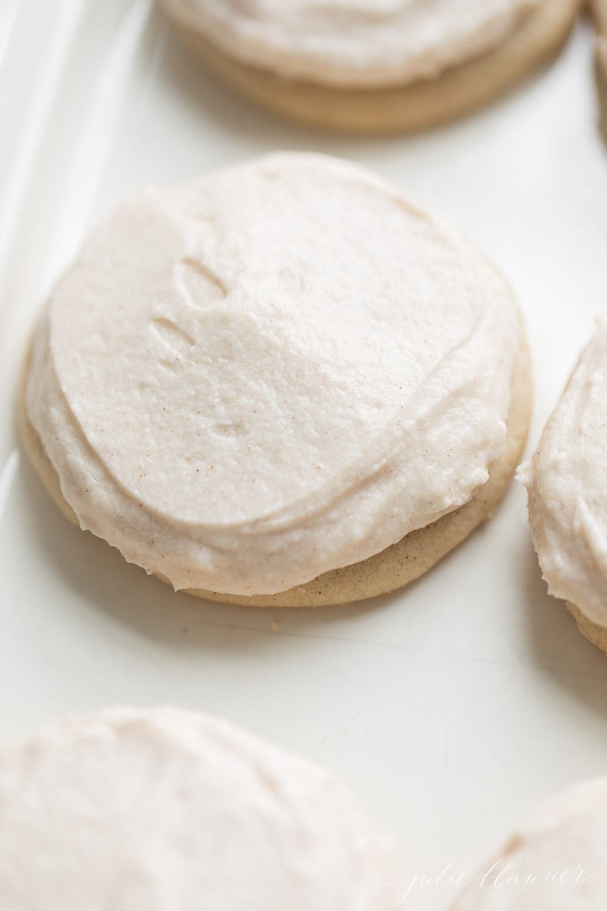 Close up of cinnamon frosting on a cookie