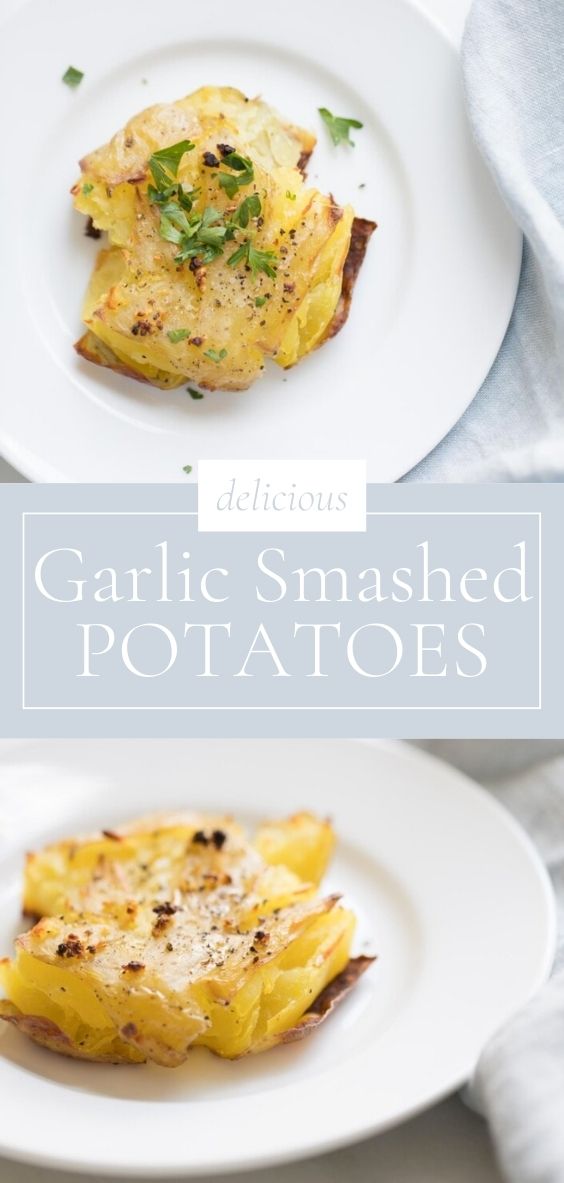 On a round white plate, there is a garlic smashed potato next to a grey napkin.