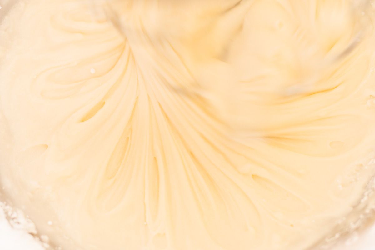 Icing ingredients being mixed in a mixing bowl