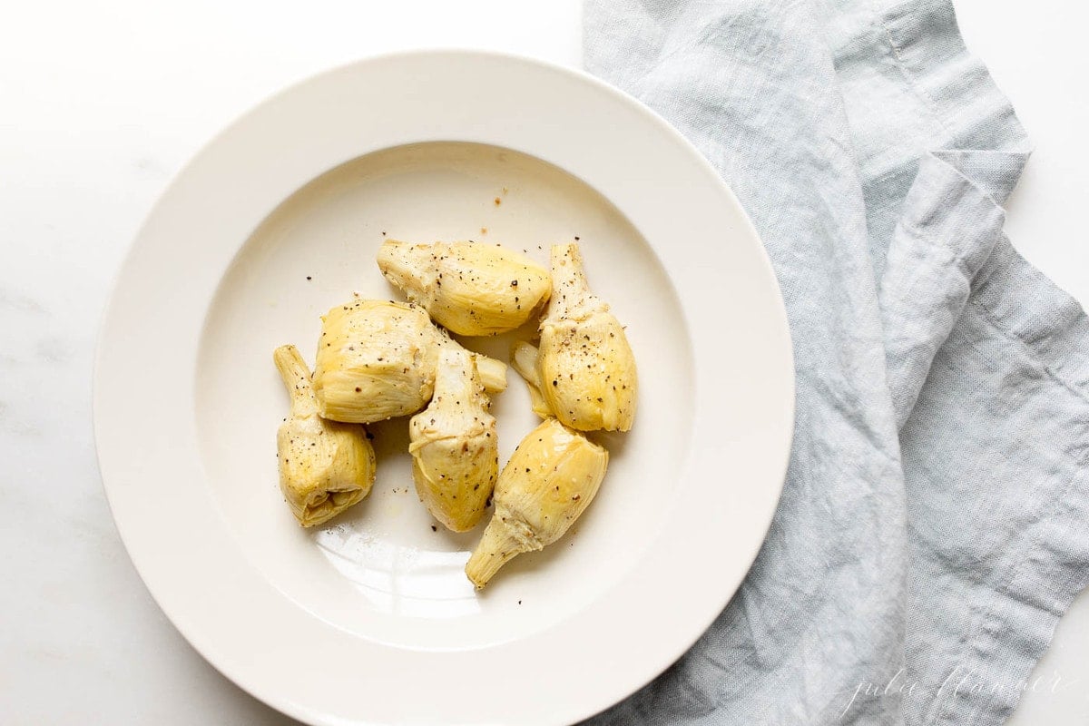 baked artichoke in serving dish