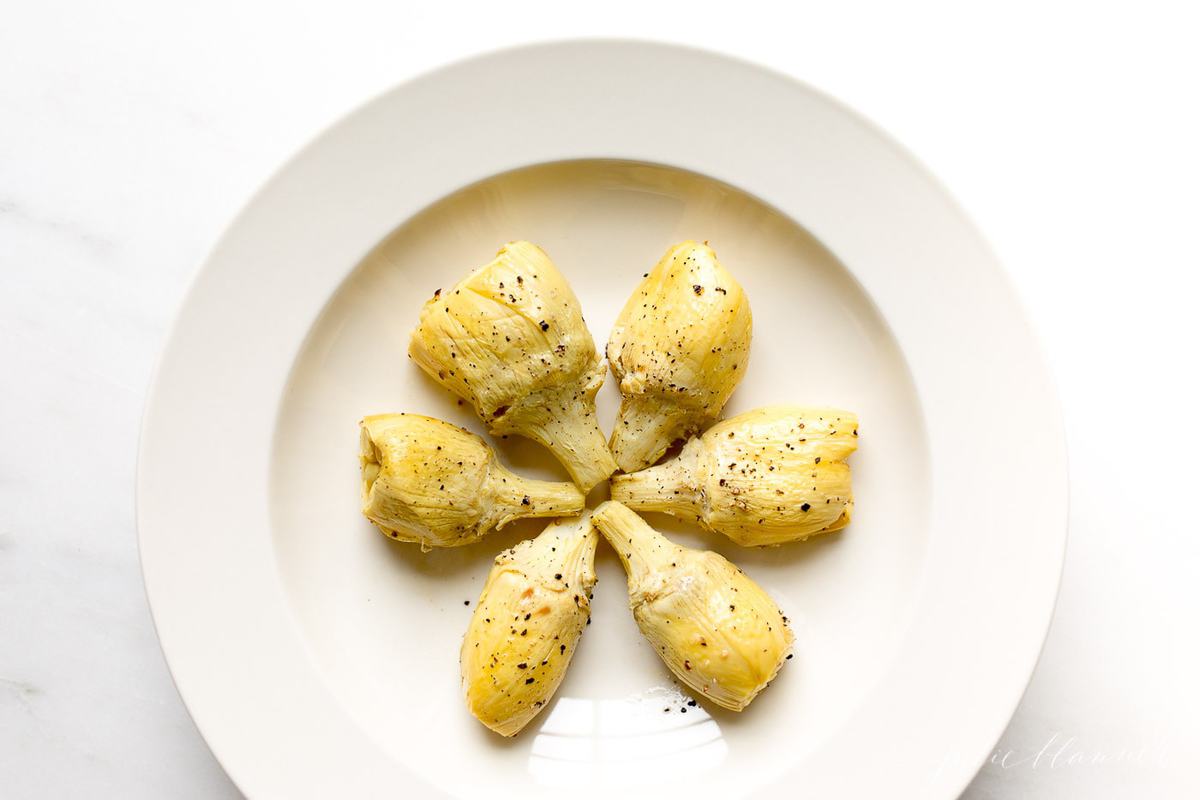 artichoke vegetable in a white serving dish