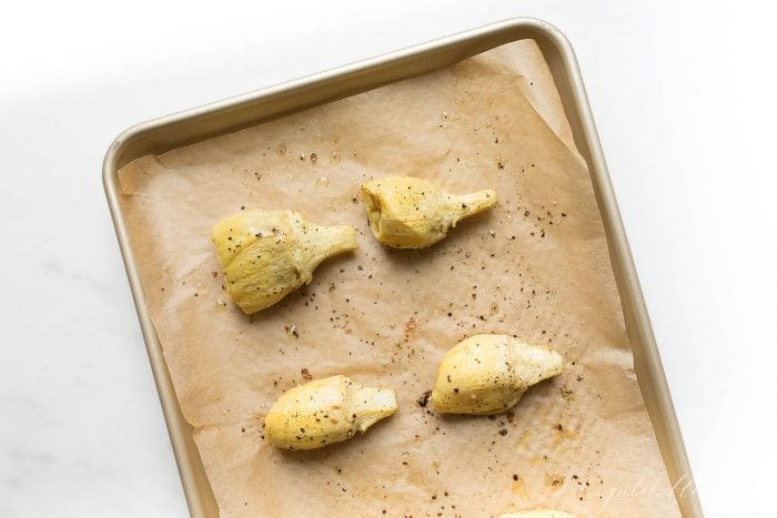 artichoke on baking sheet