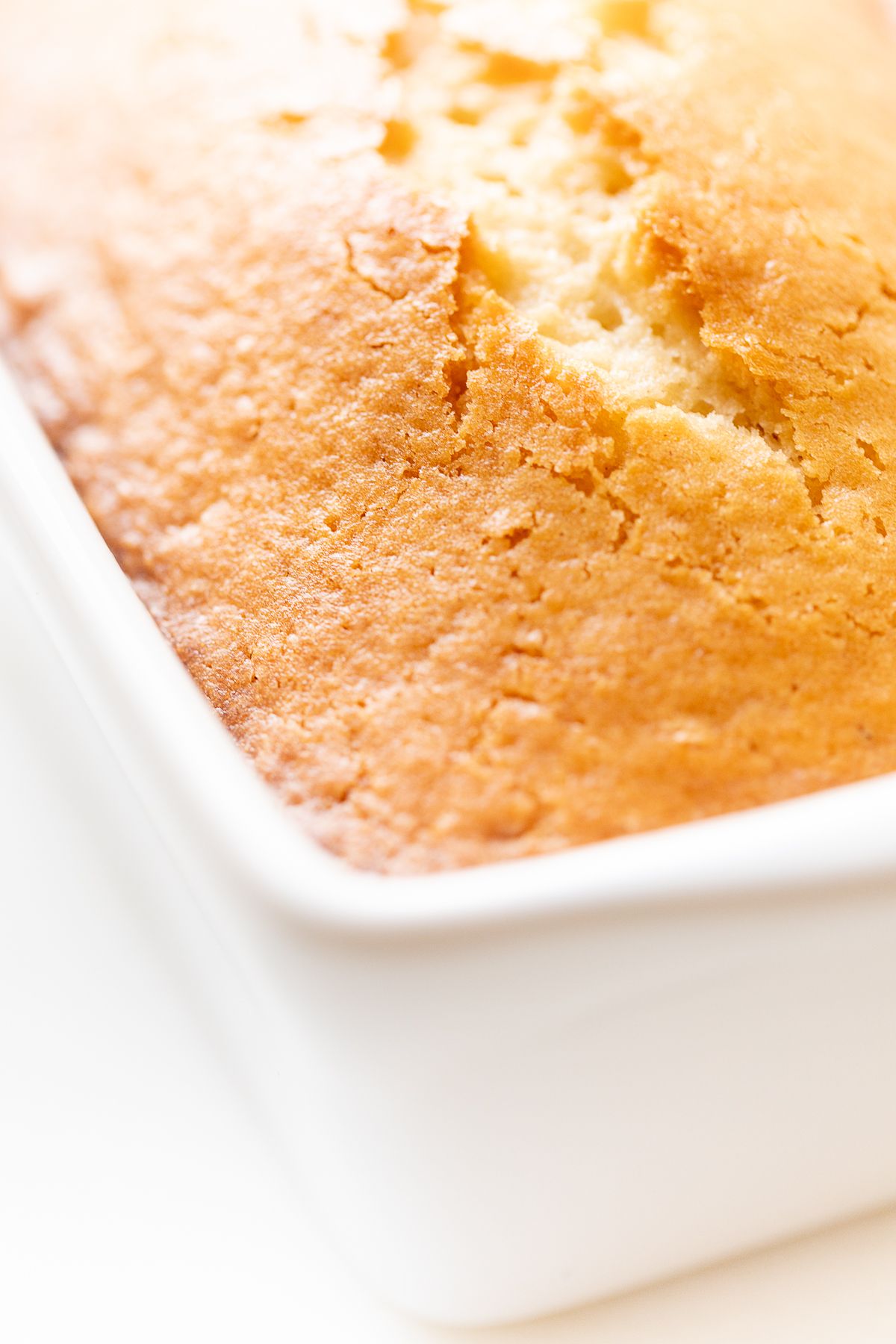 Almond bread in a white loaf pan