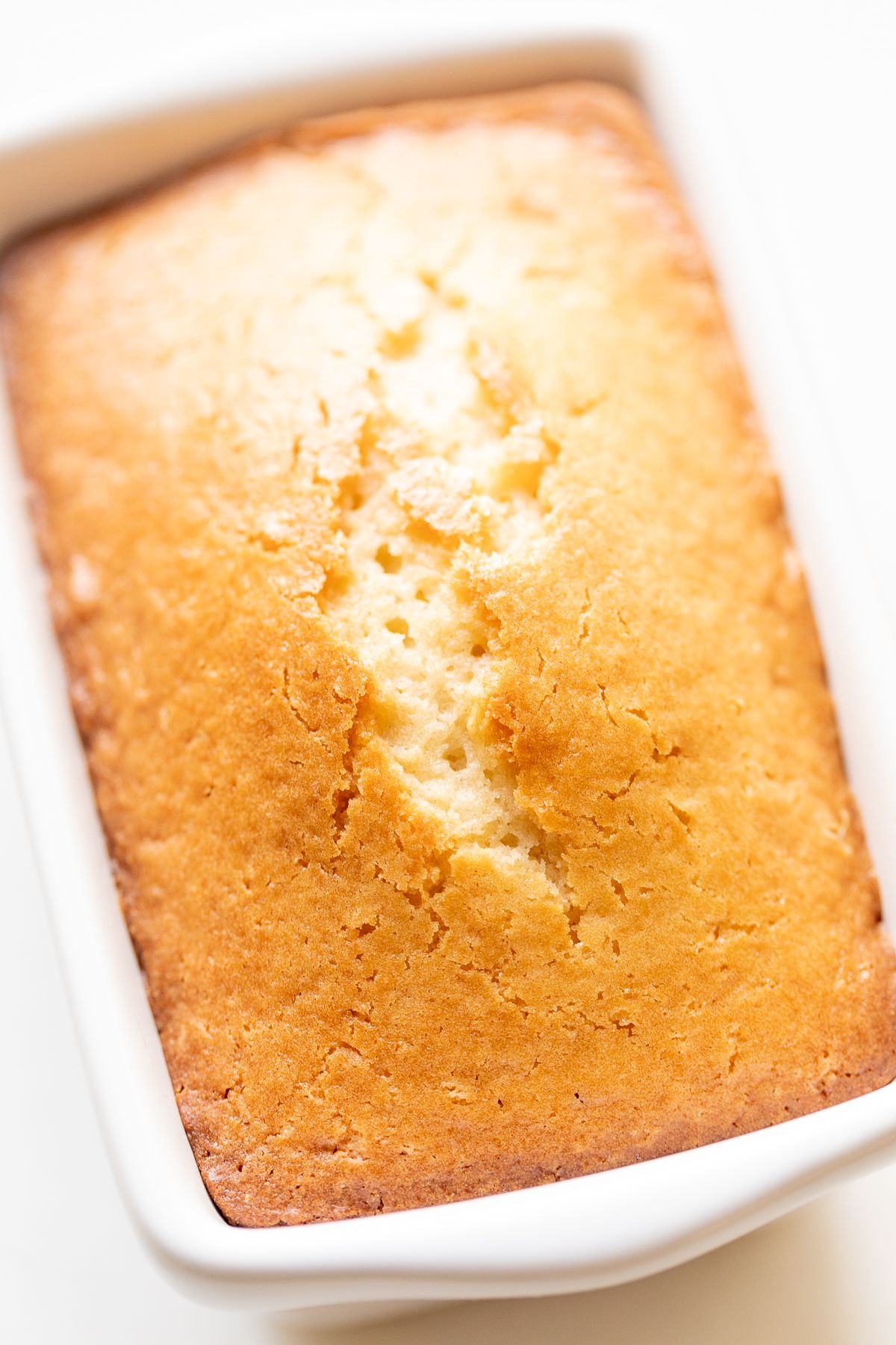 Almond bread in a white loaf pan