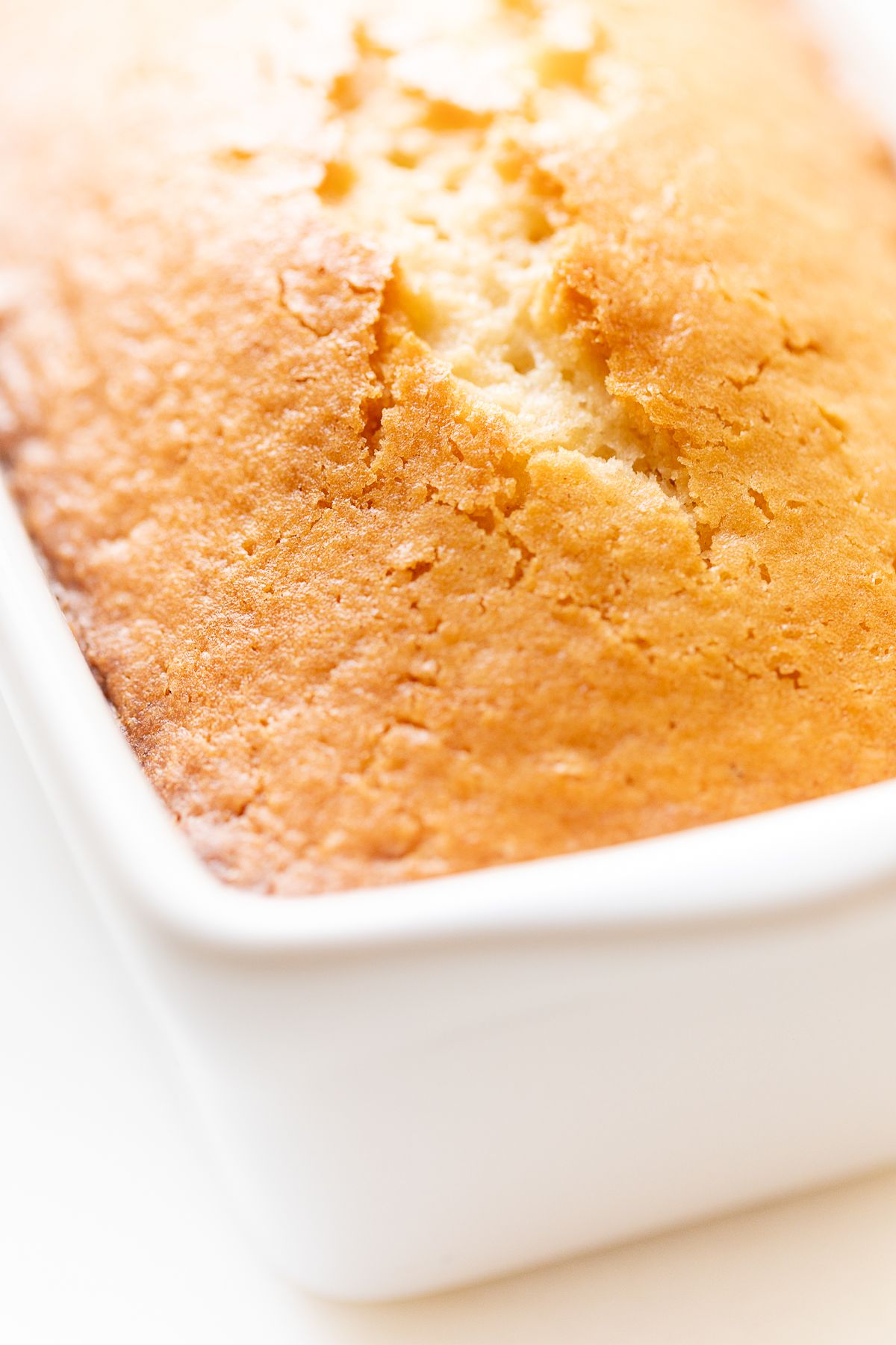 Almond bread in a white loaf pan