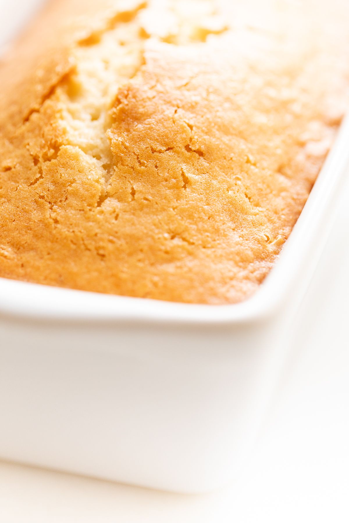 Almond bread in a white loaf pan